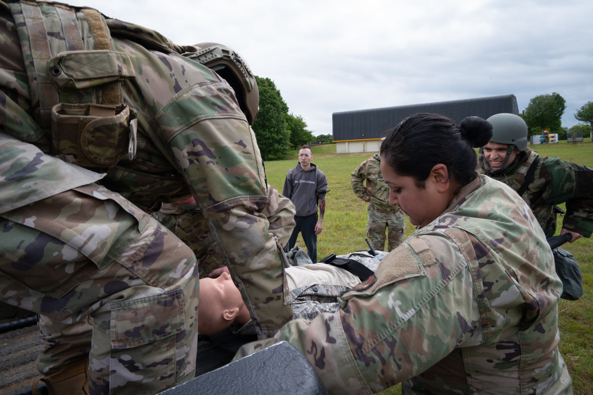 Members of the 501st Combat Support Wing load a simulated casualty onto a transport vehicle