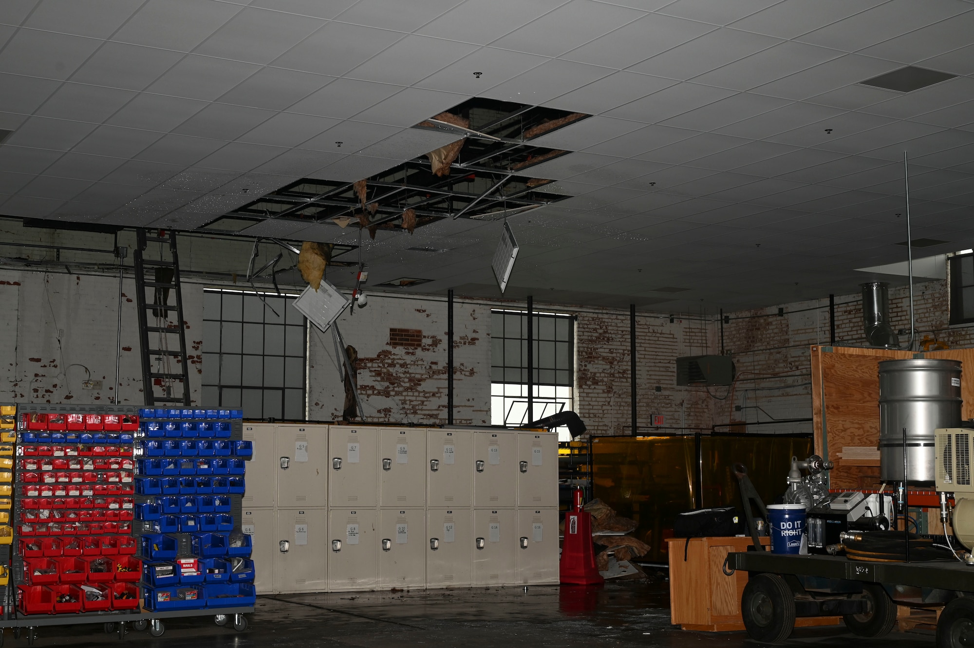 Sections of the drop ceiling and insulation in the 22nd Air Refueling Wing’s innovation lab dangle from the ceiling after a fire at McConnell Air Force Base, Kansas, June 3, 2025. It is suspected the building was struck by lightning during a severe thunderstorm in the area. (U.S. Air Force photo by Senior Airman Paige Weldon)