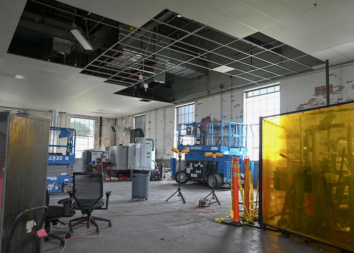 Civilians from the 22nd Civil Engineer Squadron work to repair the ceiling of the 22nd Air Refueling Wing’s innovation lab after a fire at McConnell Air Force Base, Kansas, June 12, 2025. The fire originated in the ceiling of the north side of the building during a severe thunderstorm the previous week. (U.S. Air Force photo by Senior Airman Paige Weldon)