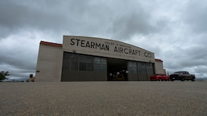 The hangar doors of the 22nd Air Refueling Wing’s innovation lab are opened to ventilate the building at McConnell Air Force Base, Kansas, June 12, 2025. The 22nd Civil Engineer Squadron ventilated the building as part of their salvage and overhaul efforts following a building fire the week prior. (U.S. Air Force photo by Senior Airman Paige Weldon)