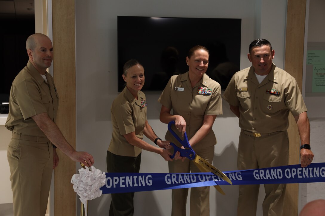 U.S. Marine Corps Brig. Gen. Maura M. Hennigan, commanding general, 2nd Marine Logistics Group, alongside U.S. Navy Sailors from Naval Medical Center Camp Lejeune, complete the ribbon cutting for the grand opening of the Marine Centered Medical Home French Creek on Marine Corps Base Camp Lejeune, North Carolina, June 10, 2025. MCMHFC provides care for the approximately 7,000 Marines and Sailors within 2nd Marine Logistics Group. (U.S. Marine Corps photo by Cpl. Apollo Wilson)
