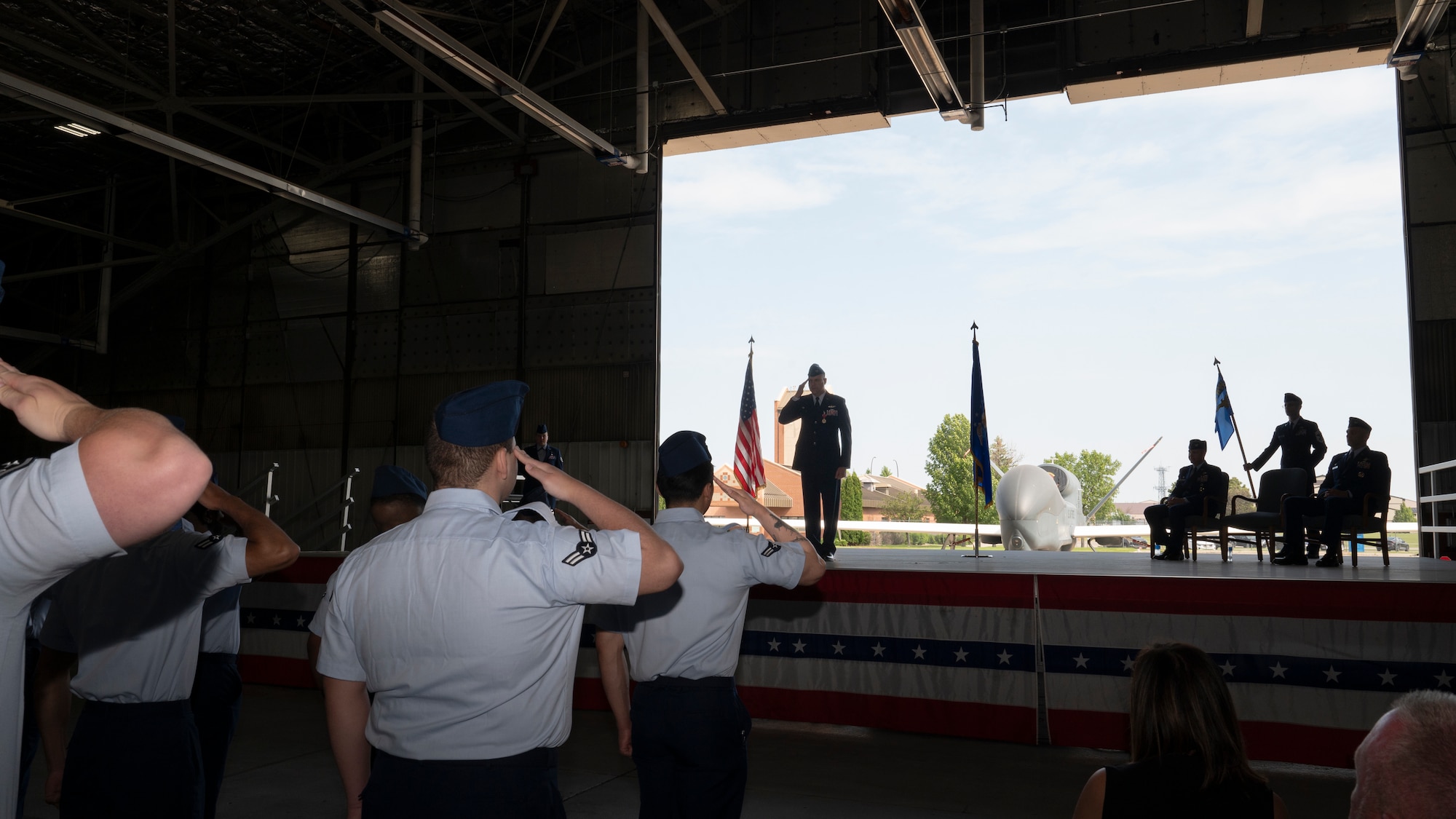 Airmen from the 319th Operations Group salute Col. Eric Steele, outgoing 319th OG commander, during a change of command ceremony at Grand Forks Air Force Base, N.D., June 13, 2025.