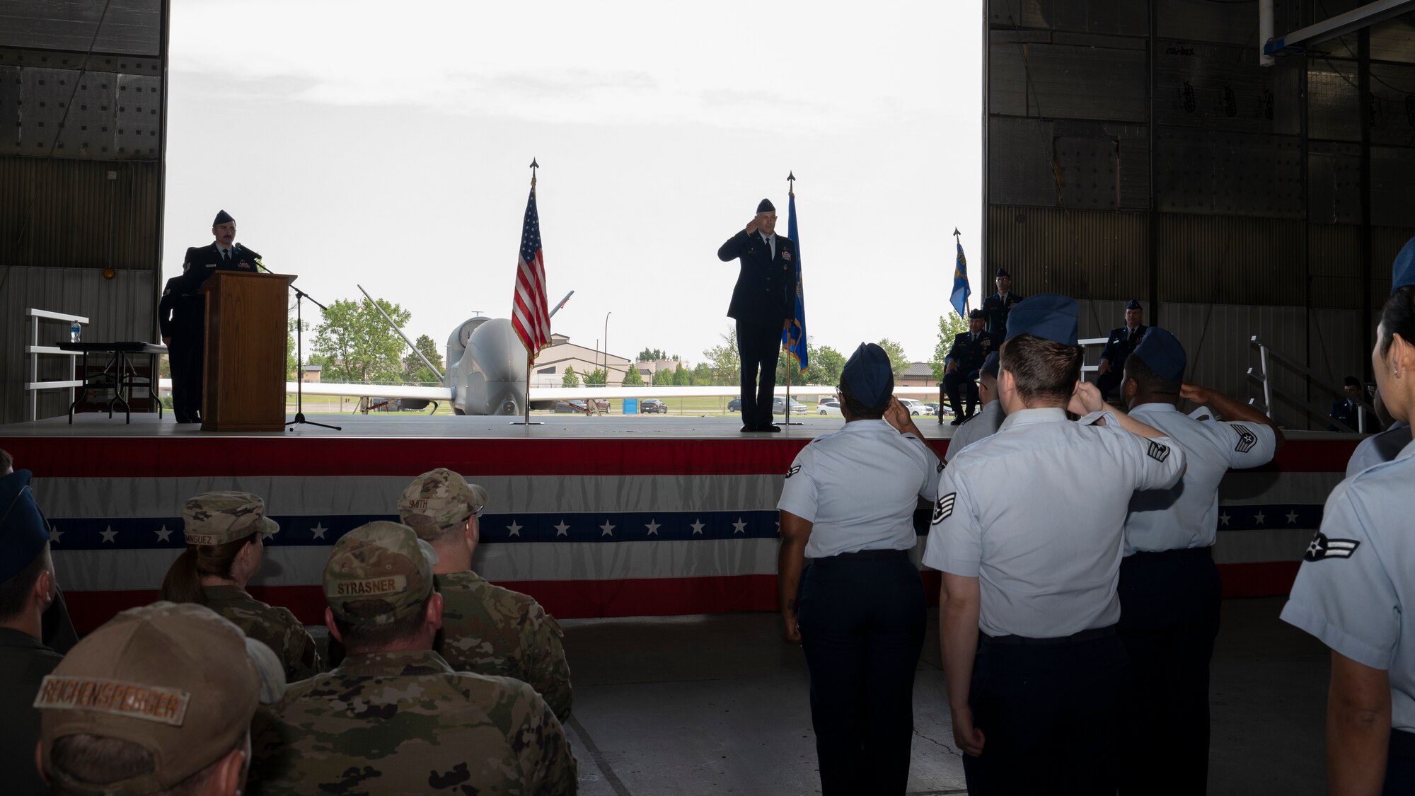 Airmen from the 319th Operations Group render the ceremonial first salute to Col. Brandon Cieloha, 319th OG commander, during a change of command ceremony at Grand Forks Air Force Base, N.D., June 13, 2025.