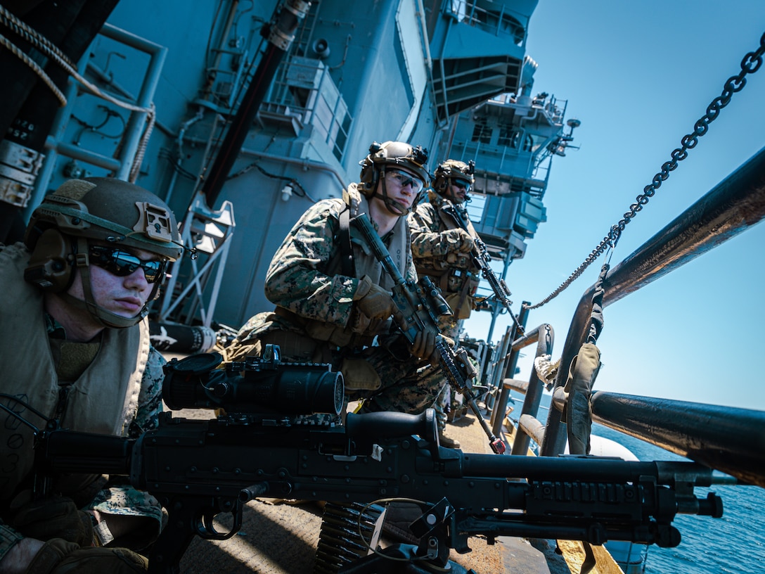U.S. Marines with 22nd Marine Expeditionary Unit provide security while conducting defense of the amphibious task force in support of a simulated strait transit aboard the Wasp-class amphibious assault ship USS Iwo Jima (LHD 7), in support of Iwo Jima Amphibious Ready Group Marine Expeditionary Unit Exercise (ARGMEUEX) while underway in the Atlantic Ocean, May 22, 2025. During ARGMEUEX, the 22nd MEU, aboard IWO ARG shipping, conducts various mission essential tasks that enhance operational readiness and lethality as a unified IWOARG/22 MEU team. (U.S. Marine Corps photo by Sgt. Tanner Bernat)