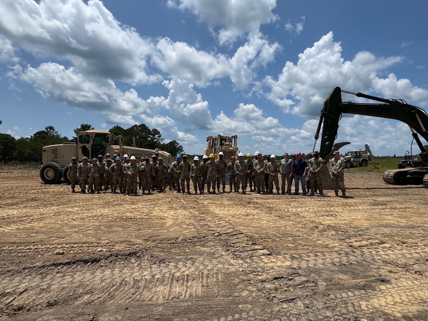 Fort Benning Range Control team members and Soldiers from the Georgia Army National Guard’s 177th Engineer Support Company of the 878th Engineer Battalion, Augusta, Georgia, pose for a picture after completing enhancements to Burroughs Range, June 6, 2025, Fort Benning, Georgia.
