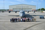 U.S. Airmen assigned to the 165th Airlift Wing (AW), Georgia Air National Guard, and civilian employers pose in front of the 165 AW C-130J Super Hercules, during an (ESGR) Boss Lift event hosted at Savannah Air National Guard Base, Georgia, June 11, 2025. The event seeks to strengthen the bond and understanding between employers and their employees who serve in the National Guard and Reserve by offering them the opportunity to fly on a military aircraft and learn more about the mission of the Air National Guard. (U.S. Air National Guard photo by Senior Airman Christa Ross)