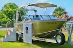 A 23-foot hydrographic survey vessel named Beale, to honor the selfless service of Sgt. 1st Class John C. Beale, during a ceremony in Savannah, June 12, 2025. The dedication ceremony, often referred to as a christening ceremony, is a long-standing tradition dating back thousands of years. Vessel christening has long been a symbol of brining good luck to the team members or crew aboard the vessel