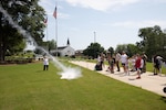 Students from the Peach State STARBASE program launch model rockets in front of the Clay National Guard Center headquarters in Marietta, Ga. June 11, 2025.
