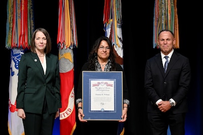 Jennifer C. Walsh, Performance Improvement Officer, Director, Administration and Management, presents a Spirit of Service Recognition award to Dianna M. Wilson during the Department of Defense Spirit of Service ceremony, a celebration of public service at the Pentagon, Arlington, Va., May 7, 2025.  (U.S. Army photo by Mr. Leroy Council)