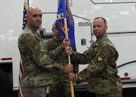 Lt. Col. Joshua Isom accepts command of the 341st Missile Maintenance Squadron during a ceremony June 13, 2025, at Malmstrom Air Force Base, Montana.