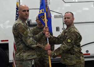 Lt. Col. Joshua Isom accepts command of the 341st Missile Maintenance Squadron during a ceremony June 13, 2025, at Malmstrom Air Force Base, Montana.