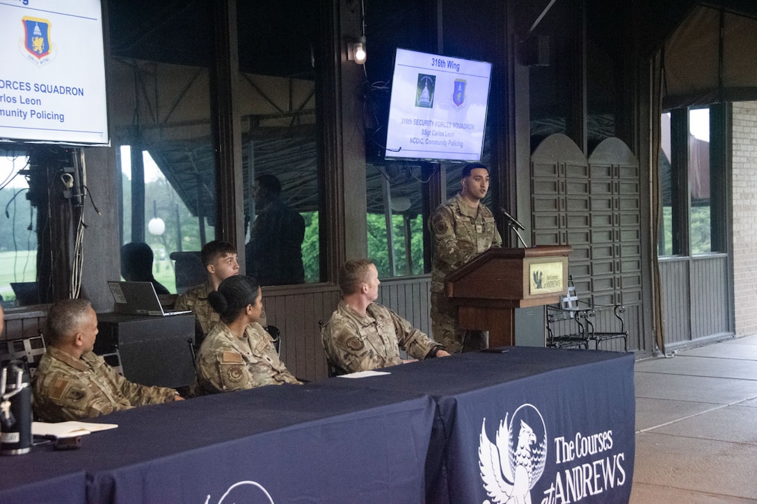 Staff Sgt. Carlos Leon provides security updates during a town hall.
