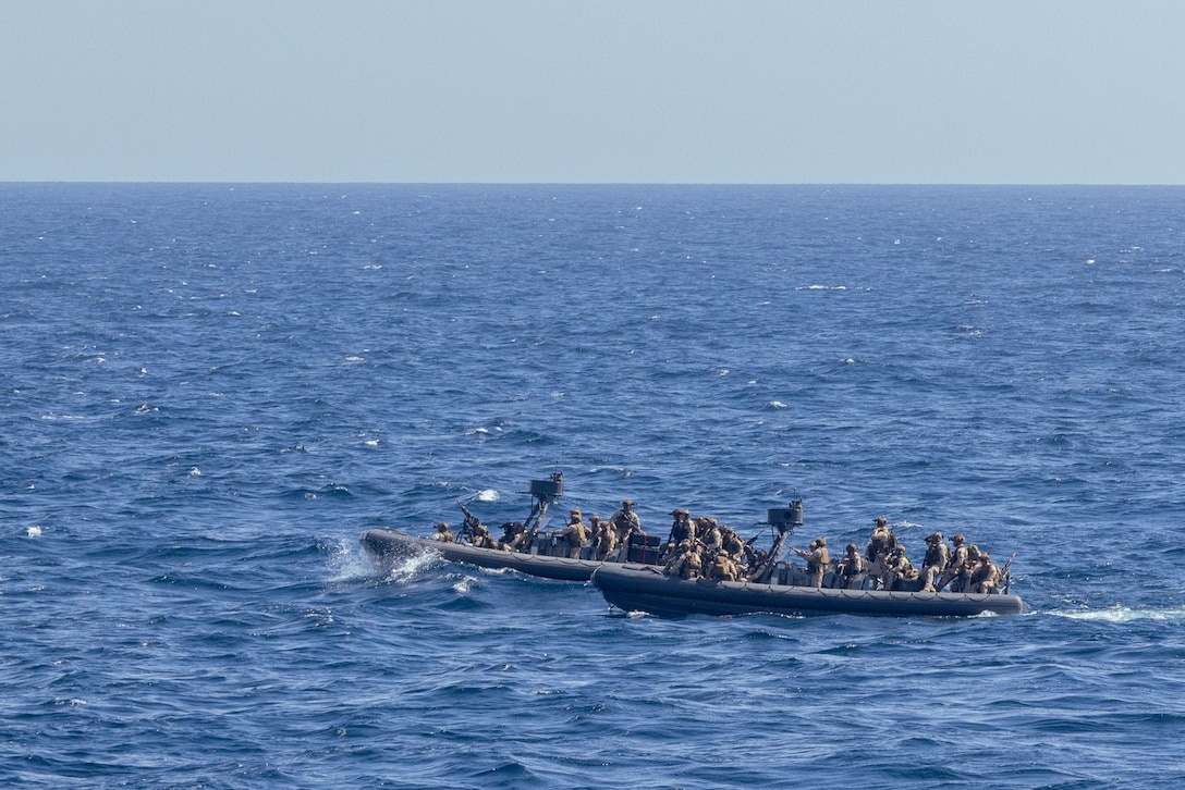 U.S. Marines with Maritime Special Purpose Force and Weapons Company, Battalion Landing Team 3/6, both with the 22nd Marine Expeditionary Unit, approach the Training Support Vessel (TSV) 5 Vindicator, Training Support Vessel Squadron 4, while conducting maritime interception operations as part of Amphibious Ready Group MEU exercise (ARGMEUEX), while underway in the Atlantic Ocean, May 18, 2025. During ARGMEUEX, the 22nd MEU, aboard Iwo Jima Amphibious Ready Group (IWOARG) shipping, conducts training in support of various mission essential tasks that enhance operational readiness and lethality as a unified IWOARG/22 MEU team. (U.S. Marine Corps photo by Lance Cpl. Kyle Baskin)