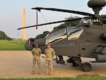 Crew members from the 1-130th Attack Battalion, North Carolina Army National Guard, support a static display during the U.S. Army's 250th birthday celebration on the National Mall in Washington, D.C., Saturday, June 14, 2025. The event honors 250 years of Army history and service to the nation.