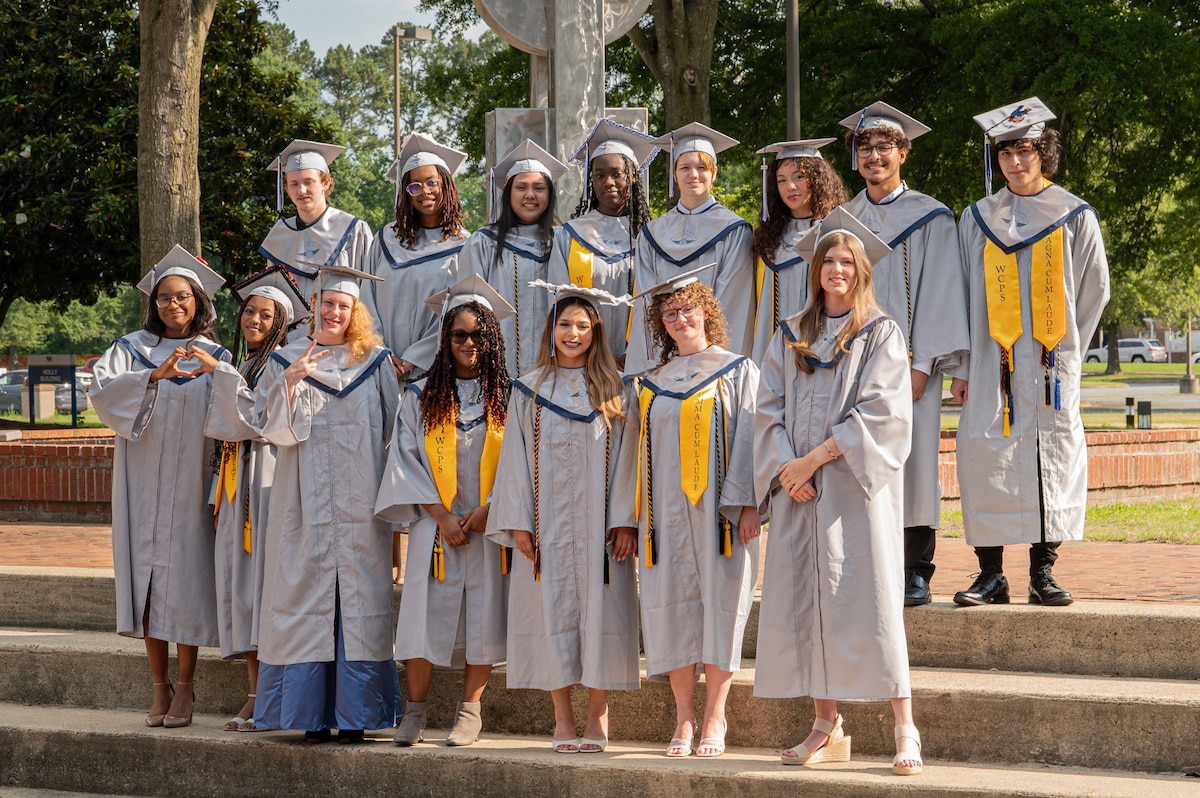 Students in the ir graduation robes group photo