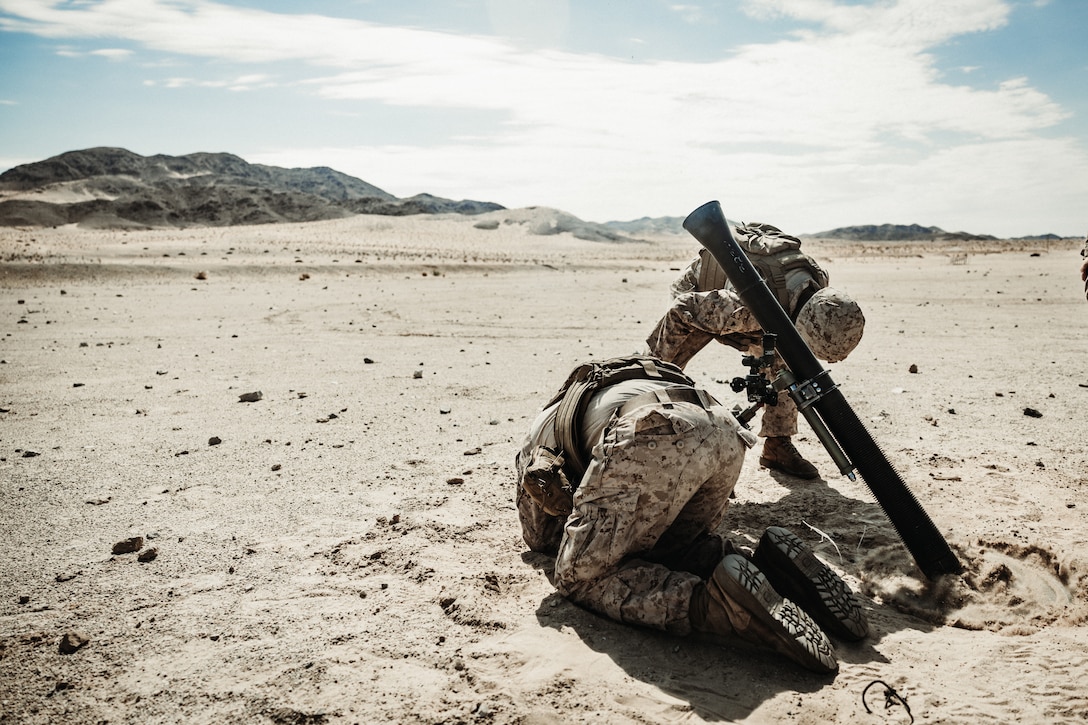 U.S. Marine Corps Lance Cpl. Daniel Puente, right, and Lance Cpl. Riley Davis, both Texas natives, mortarmen with 1st Battalion, 23rd Marine Regiment, 4th Marine Division, fire an M252 81 mm mortar system during a mortar live fire training as part of Integrated Training Exercise 3-25 at Range 106A, Marine Corps Air Ground Combat Center, Twentynine Palms, California, June 4, 2025. MCAGCC serves as the Marine Corps’ premier training venue for service-level training exercises by providing a realistic multi-domain environments to prepare forces for success in future conflicts. (U.S. Marine Corps photo by Lance Cpl. Richard PerezGarcia)