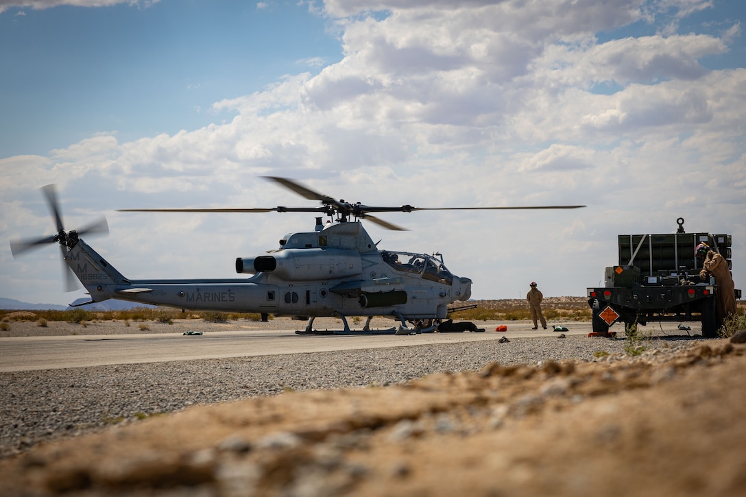 A U.S. Marine Corps AH-1Z Cobra helicopter assigned to Marine Light Attack Helicopter Squadron (HMLA) 773, Marine Aircraft Group 29, is checked for maintenance prior to take off during Integrated Training Exercise 3-25 at Marine Corps Air Ground Combat Center, Twentynine Palms, California, June 6, 2025. MCAGCC serves as the Marine Corps’ premier training venue for service-level training exercises by providing realistic multi-domain environments to prepare forces for success in future conflicts. (U.S. Marine Corps photo by Sgt. Makayla Elizalde)