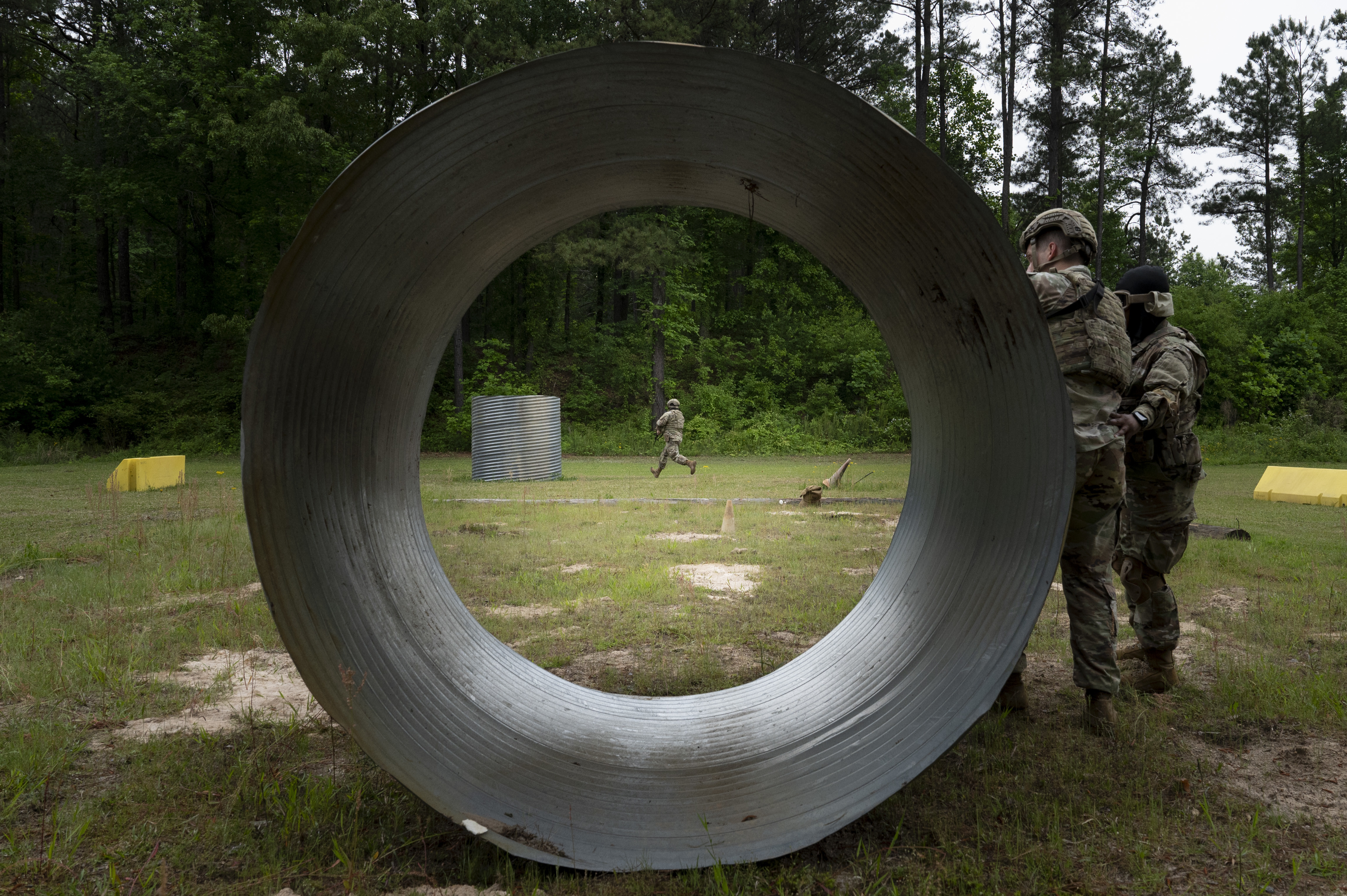 A U.S. Airman assigned to the 94th Security Forces Squadron, center, runs to cover at Dobbins Air Reserve Base, Ga., May 7, 2025, during a “Shoot, Move, Communicate” training exercise. Airmen practiced deliberate, suppressive fire tactics and improved communication while navigating simulated threats in a fail-safe environment. (U.S. Air Force photo by Staff Sgt. Gage Daniel)