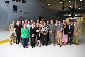 Staff members from various Ohio federal and state offices pose for a photo with Col. Chris Sedlacek, 910th Airlift Wing commander, and Citizen Airmen in front of a C-130J Super Hercules during a visit to Youngstown Air Reserve Station, Ohio, June 13, 2025.