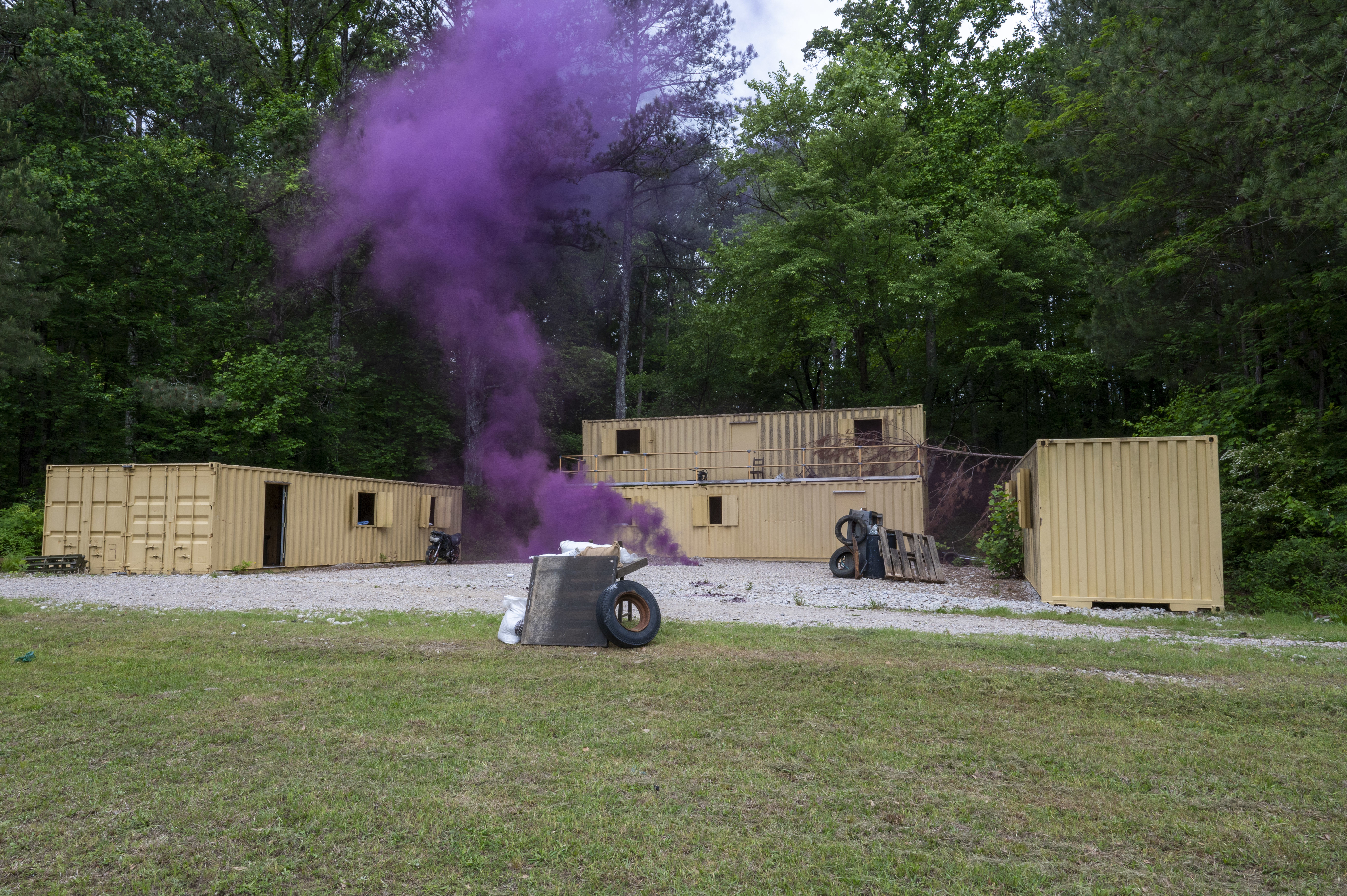 A Military Operations on Urbanized Terrain site is filled with smoke at Dobbins Air Reserve Base, Ga., May 7, 2025, during a 94th Security Forces Squadron training exercise. Realistic training environments are used to build proficiency in fire-and-maneuver tactics among Defenders. U.S. Air Force photo by Staff Sgt. Gage Daniel)