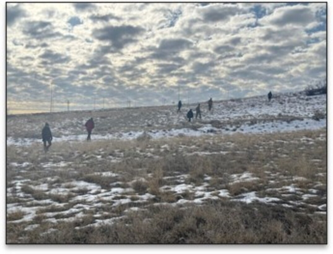 Members of the 34th FEST-A survey and assess the proposed location for the Deployment Storage Facility. The team identified a suitable location requiring minimal earthwork and proximity to existing utility infrastructure.