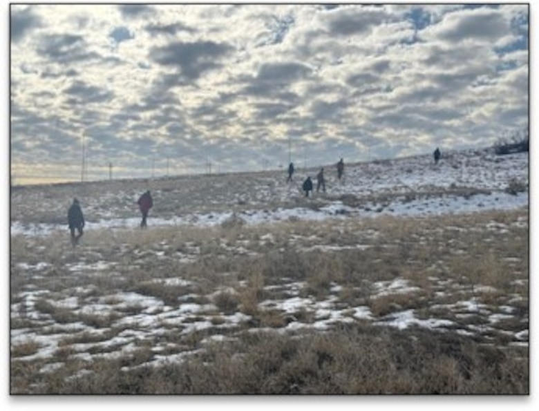 Members of the 34th FEST-A survey and assess the proposed location for the Deployment Storage Facility. The team identified a suitable location requiring minimal earthwork and proximity to existing utility infrastructure.