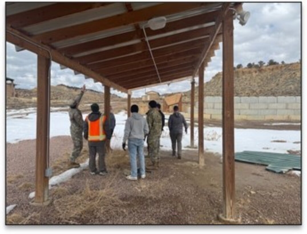 34th EST-A members inspect the Range 131C awnings to identify solutions to repair damaged roof sections and develop a cost-effective replacement.