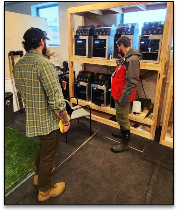 Justin McNabb (NWS) and Seth Chiles (NWK) assess 3D printers in the ATOC to determine air quality and HVAC requirement to ensure hazardous fumes are not present for 10th SFG personnel.
