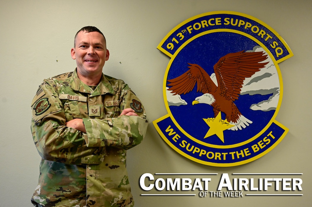 A man in uniform poses for a photo.