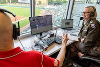 Col. Michelle M. Williams, U.S. Army Financial Management Command commander, talks with Indianapolis Indians announcer Howard Kellman during a baseball game at Victory Field in Indianapolis June 14, 2025. Williams talked about how the Army and Army Finance Corps' 250th birthdays just two days apart, as the Finance Corps was founded on June 16, 1775. (U.S. Army photo by Mark R. W. Orders-Woempner)