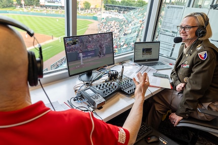 Col. Michelle M. Williams, U.S. Army Financial Management Command commander, talks with Indianapolis Indians announcer Howard Kellman during a baseball game at Victory Field in Indianapolis June 14, 2025. Williams talked about how the Army and Army Finance Corps' 250th birthdays just two days apart, as the Finance Corps was founded on June 16, 1775. (U.S. Army photo by Mark R. W. Orders-Woempner)