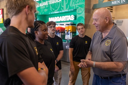 Retired Brig. Gen. James L. Bauerle, Army Reserve Ambassador, talks with Future Soldiers at an Indianapolis Indians baseball game at Victory Field in Indianapolis June 14, 2025. Eighteen Future Soldiers took the Oath of Enlistment before the game, which paid special tribute to the Army's 250th birthday. (U.S. Army photo by Mark R. W. Orders-Woempner)