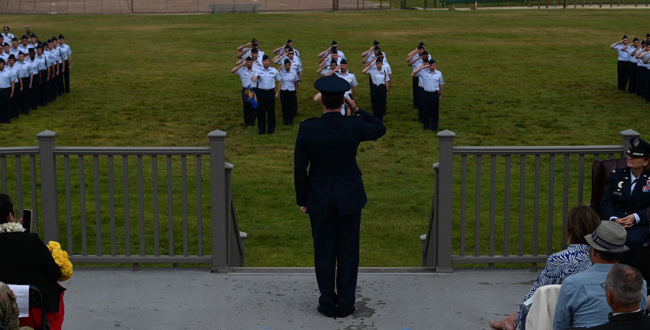 U.S. Air Force Airmen assigned to the 517th Training Group present Col. Jason Guyette, 517th TRG commander, with his first salute upon taking command on Soldier Field at Presidio of Monterey, California, June 12, 2025. The 517th TRG is integrated with the Defense Language Institute Foreign Language Center operated by the Army. DLIFLC is responsible for training more than 3,600 students in more than 24 different foreign languages with a daily student load of approximately 1,300 Air Force students. (U.S. Air Force photo by Staff Sergeant Nathan Call)