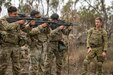 Lance Cpl. Simon Dale, section commander from the 6th Battalion, the Royal Australian Regiment instructs U.S. soldiers from Comanche Company, 4th Battalion, 6th Infantry Regiment, on how to use the Australian F88 Austeyr, during a training circuit at Townsville Field Training Area in Australia, July 18, 2023, in preparation for Talisman Sabre 23.