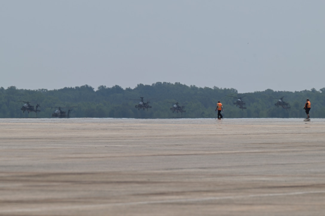 U.S. Army AH-64 Apache helicopters assigned to the 82nd Combat Aviation Brigade arrive at Joint Base Andrews.