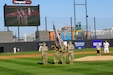 Soldiers assigned to the 85th U.S. Army Reserve Command color guard team presents the colors during the National Anthem before the start of the Chicago Dogs versus the Cleburne Railroaders baseball game at Impact Field in Rosemont, Illinois, June 14, 2025.