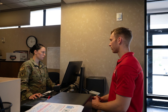 Airman assists a delivery driver.