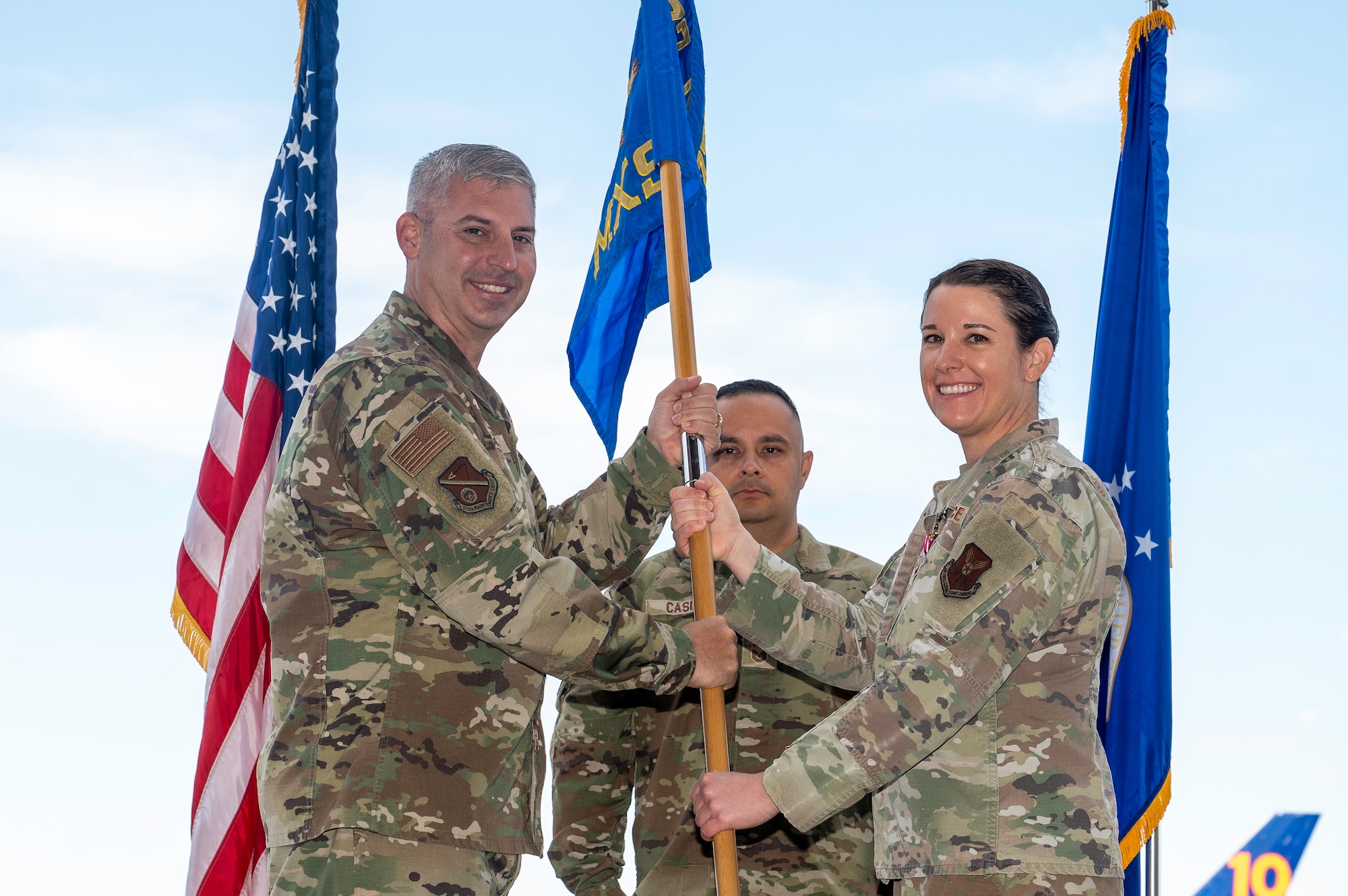 Man receives flag from woman