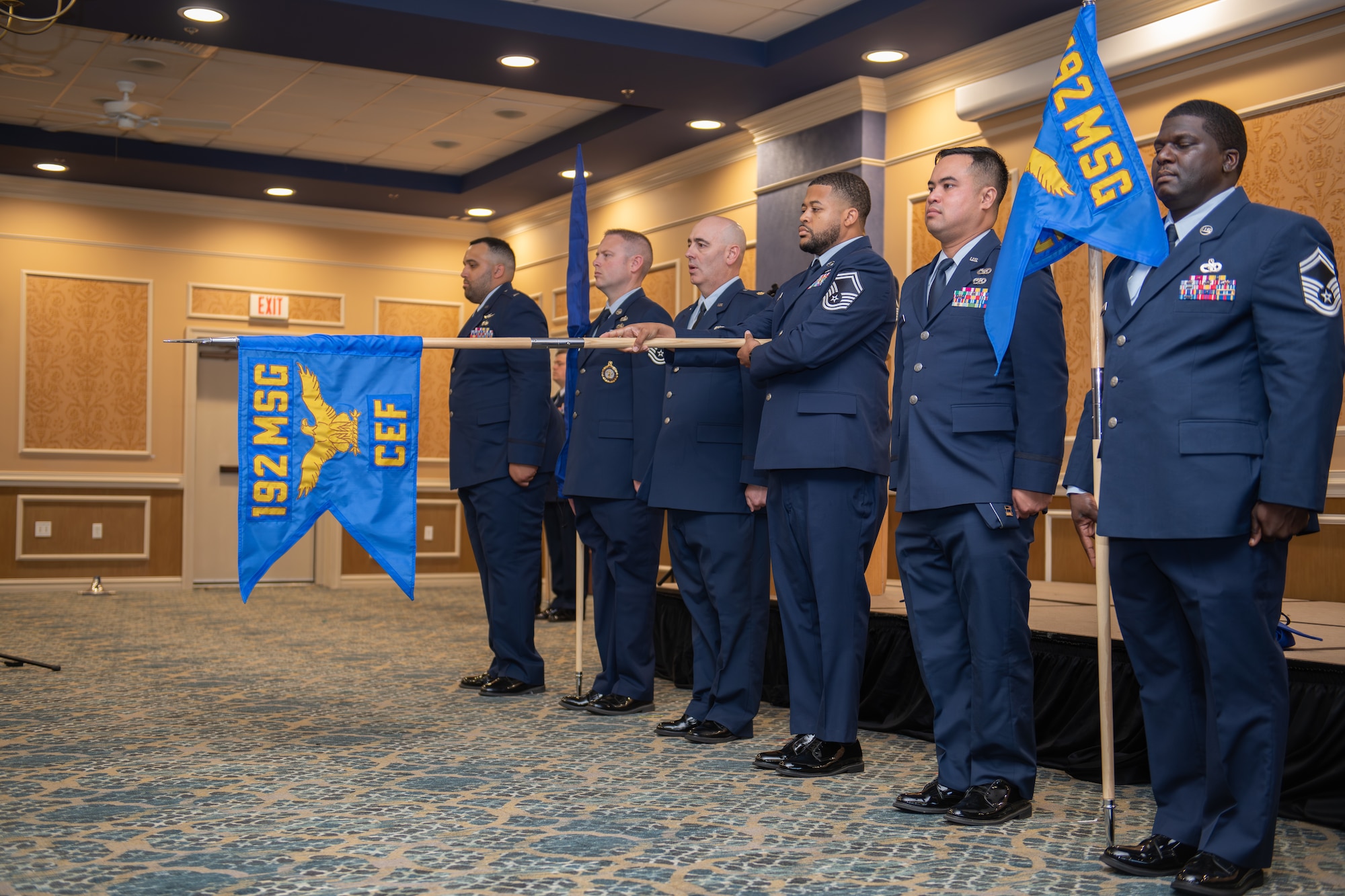 senior leaders from the 192nd Mission Support Group stand in a row with guidons for each flight and squadron with the 192nd Civil Engineering Flight is unveiled