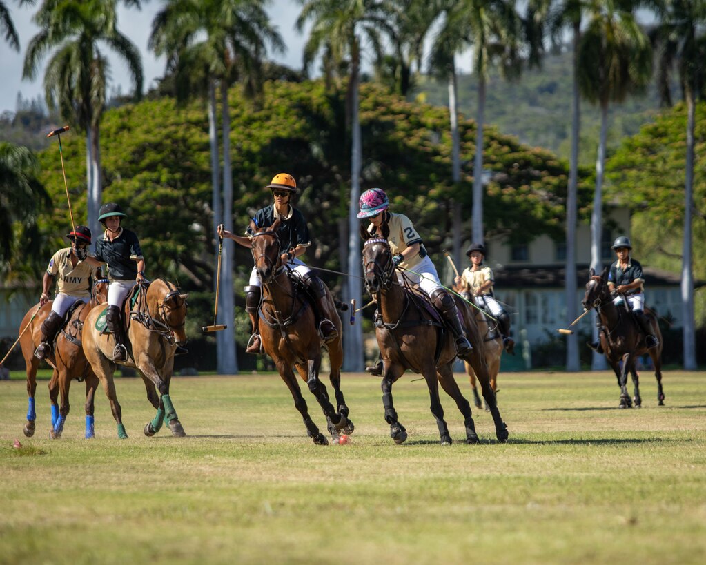 Polo players from the Honolulu Polo Club play polo on June 08, 2025, at Fort Shafter, Hawaii. U.S. Army Pacific hosted the polo match on historic Palm Circle in celebration of the Army's 250th birthday.