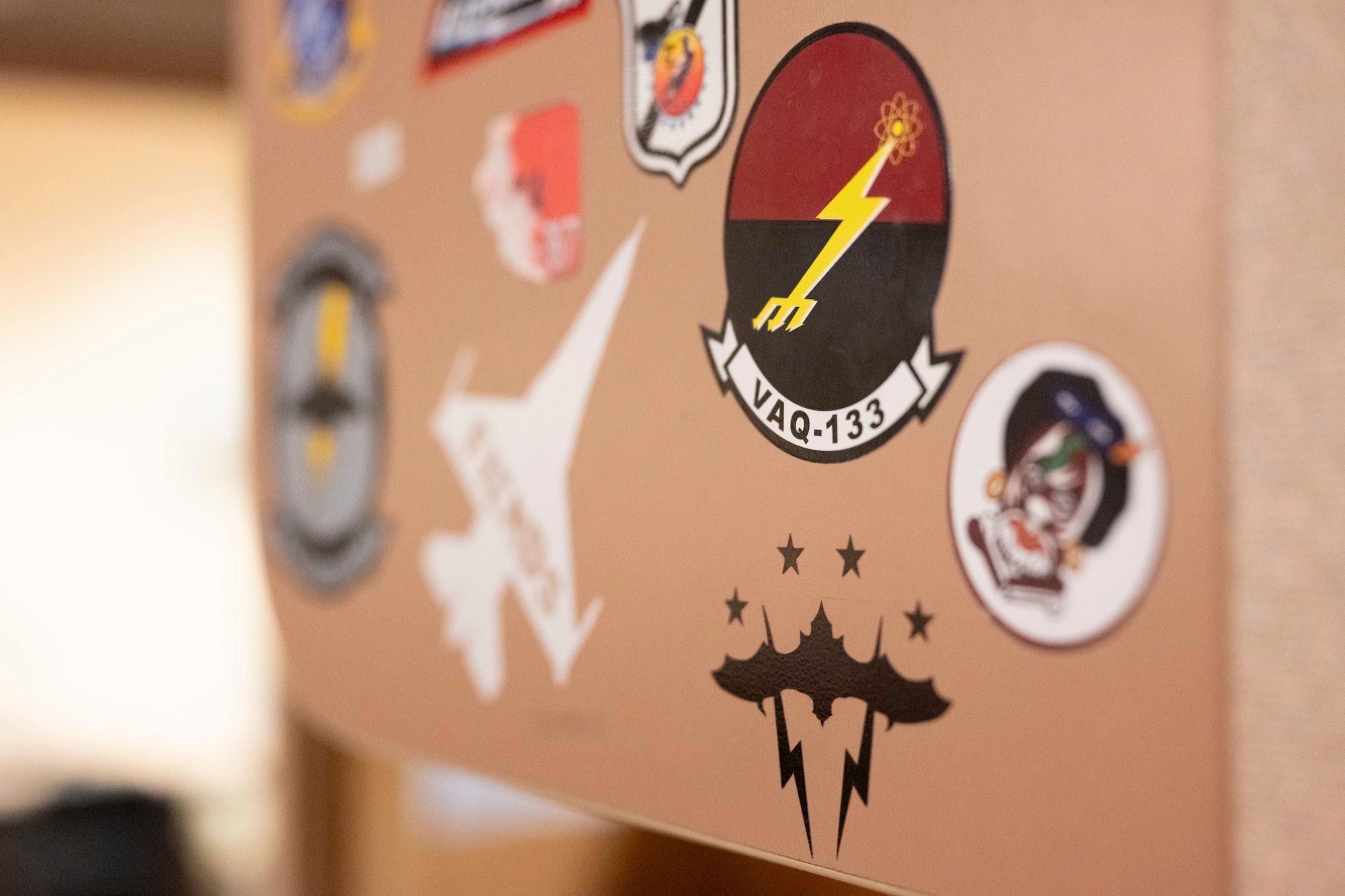 Stickers from units around the world who have supported Cope Thunder and Red Flag over the past 50 years lay on the walls of the Aircrew Flight Equipment office at the 353rd Combat Training Squadron on Eielson Air Force Base, Alaska, June 16, 2025.