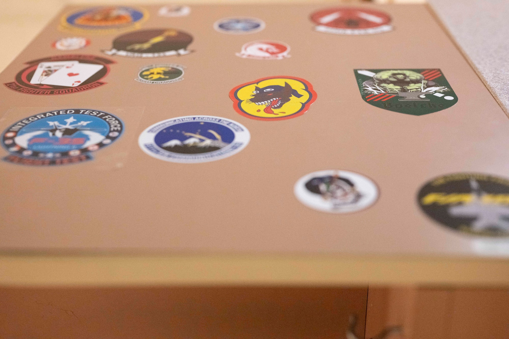 Stickers from units around the world who have supported Cope Thunder and Red Flag over the past 50 years lay on the walls of the Aircrew Flight Equipment office at the 353rd Combat Training Squadron on Eielson Air Force Base, Alaska, June 16, 2025.