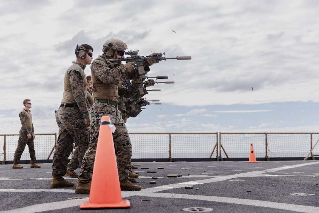 U.S. Marines with Charlie Company, Battalion Landing Team 1st Battalion, 7th Marine Regiment, 31st Marine Expeditionary Unit, conduct a combat marksmanship program training aboard amphibious dock landing ship USS Rushmore (LSD 47) in the Coral Sea, June 12, 2025. The training was conducted to enable Marines to sustain their weapon familiarity and enhance their lethality. The 31st MEU is operating aboard ships of the USS America Amphibious Ready Group in the 7th Fleet area of operations, the U.S. Navy’s largest forward-deployed numbered fleet, and routinely interacts and operates with allies and partners in preserving a free and open Indo-Pacific region. (U.S. Marine Corps photo by Cpl. Angel Diaz Montes De Oca)