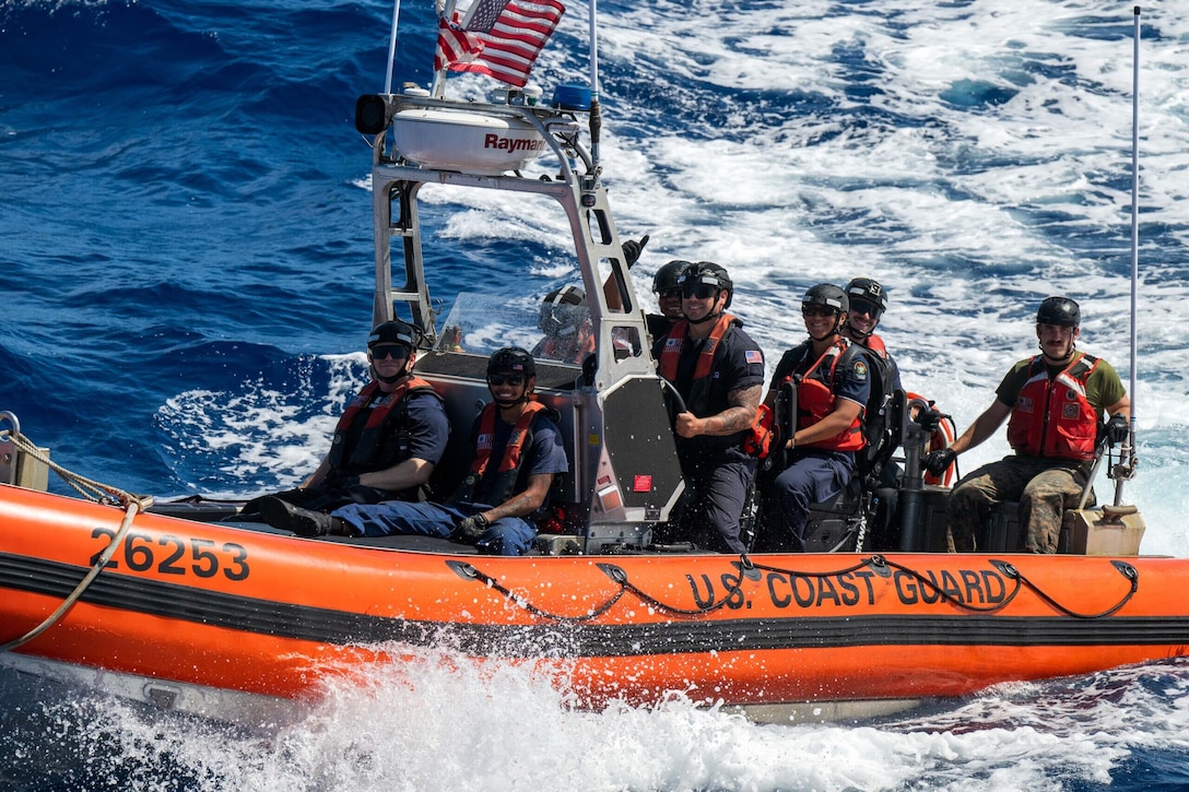 A U.S. Coast Guard Cutter Harriet Lane (WMEC 903) 26-foot over-the-horizon small boat approaches a fishing vessel during a boarding inspection with two Cook Island Ministry of Marine Resources Fishery Officers and a translator from the U.S. Marine Corps June 7, 2025 in the Pacific Ocean. The U.S. Coast Guard collaborates with the Cook Islands, in accordance with our maritime law enforcement bilateral agreements to enforce maritime laws that protect Cook Island’s territorial integrity and secure its maritime borders and approaches to promote a stronger and prosperous island nation and region for us all. (U.S. Coast Guard photo by Petty Officer 3rd Class Austin Wiley)