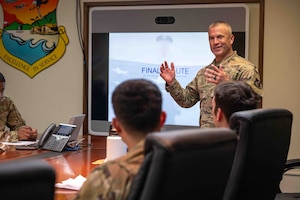 Service member talks before the presentation.