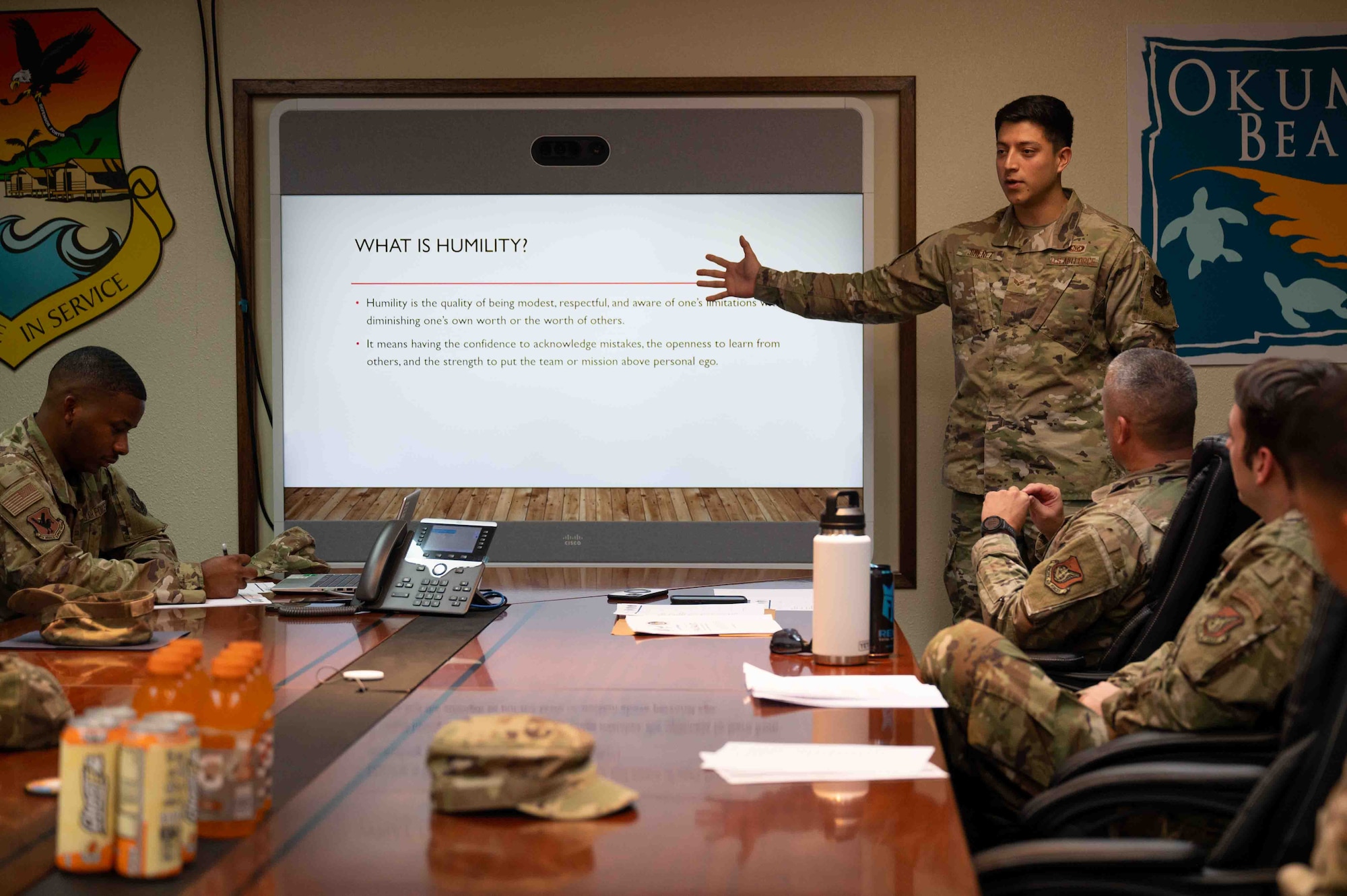 Service member presents a slideshow