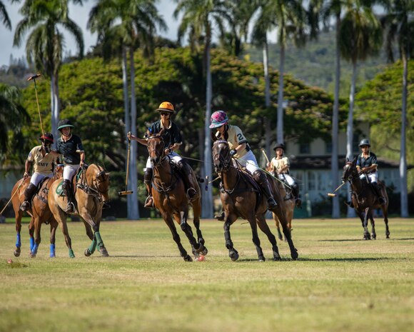 Polo players from the Honolulu Polo Club play polo on June 08, 2025, at Fort Shafter, Hawaii. U.S. Army Pacific hosted the polo match on historic Palm Circle in celebration of the Army's 250th birthday.