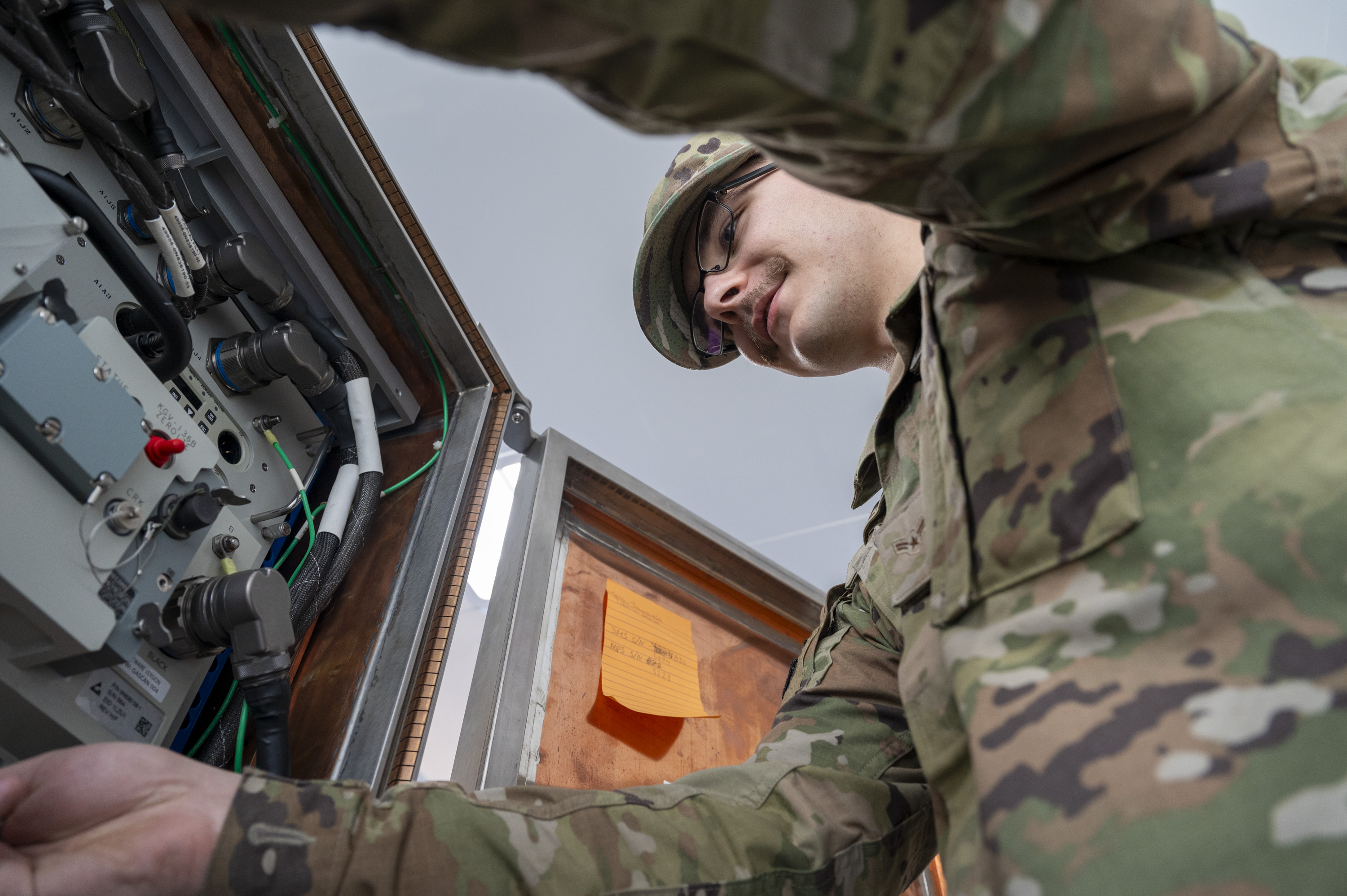 U.S. Air Force Airman 1st Class Brayden Walling, 92nd Communications Squadron radio frequency transmission technician, checks the functions on the equipment control unit at Fairchild Air Force Base, Washington, June 2, 2025.  The Global Aircrew Strategic Network Terminal system uses extremely high frequency and advanced EHF waveforms to provide protected communication capabilities in operational environments. (U.S. Air Force photo by Airman 1st Class Samantha Thorn)