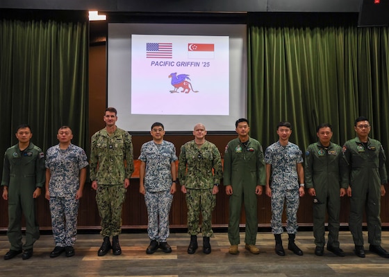 U.S. Naval Base, GUAM (June 6, 2025) – U.S. Navy Sailors from Destroyer Squadron (DESRON) Seven, the Arleigh Burke-class guided-missile destroyer USS William P. Lawrence (DDG 110), and Republic of Singapore Navy Sailors with the Independence-class littoral mission vessel RSS Sovereignty (LMV 16) and Formidable-class stealth frigate RSS Supreme (FFG 73) pose for a group picture in preparation for Pacific Griffin 2025 while in port U.S. Naval Base, Guam, June 6, 2025. Pacific Griffin 2025 is a biennial maritime exercise between the U.S. and Republic of Singapore, enhancing combined maritime proficiency while strengthening relationships during dynamic training evolutions ashore and at sea near Guam. (U.S. Navy photo by Mass Communication Specialist 3rd Class Petty Officer Gavin Arnoldhendershot)