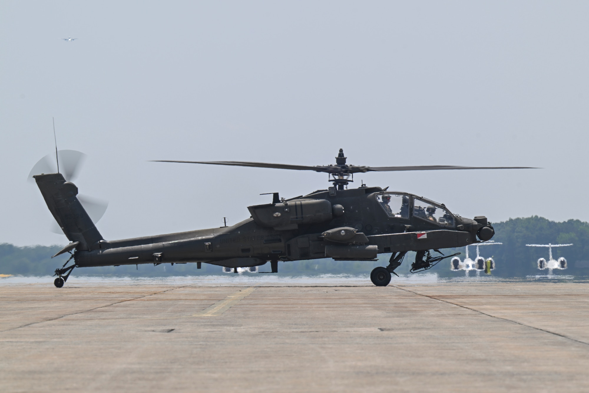 A U.S. Army AH-64E Apache Guardian helicopter assigned to the 82nd Combat Aviation Brigade taxis on the flight line.